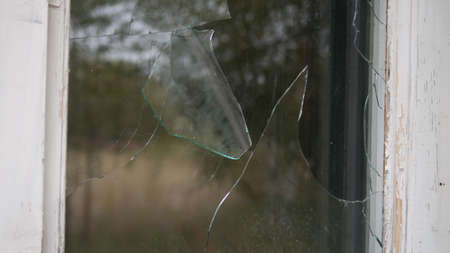 Old window with broken glass