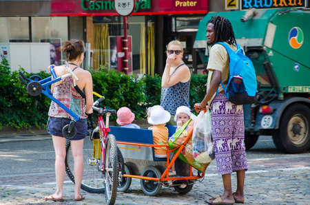 Street children in a cart with their parents.Freiburg Germany 07.19.2017