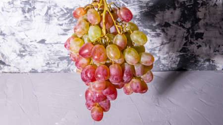 Bunch of grapes on a black and white background, close-up, with space for text, background, postcard, Wallpaper,の写真素材