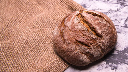 Rye bread on the table close-up, with space for text