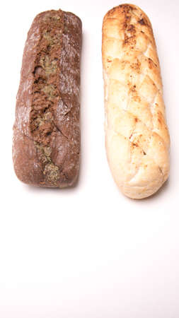 Loaf, baguette white and gray on a white background isolated close-up