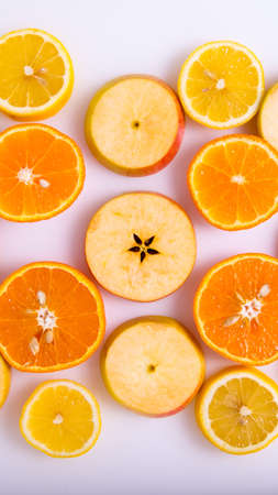 Apple and orange slices on a white background, isolated, creative layout, space for text, top viewの写真素材