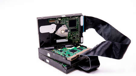 Hard drives management scheme for storing information are connected by a cable HDD Cable on a white background, isolated, space for text, electronicsの写真素材