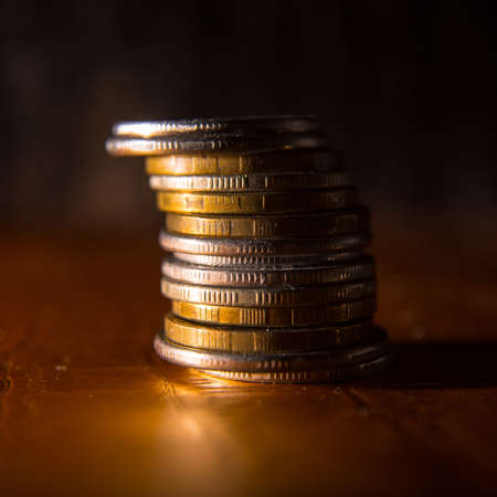 Coins laid out in a stack close-up, macro, space for text, background, postcardの写真素材