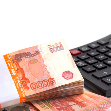Banknotes, Russian banknotes, spread out on a white background with a calculator, isolated,...