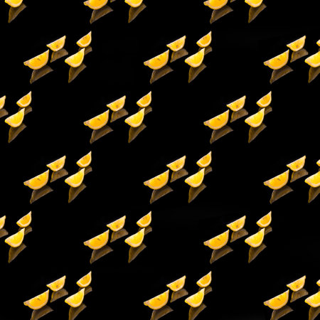 Lemon pattern lemon slices on black background, background, texture, pattern, flat viewの写真素材