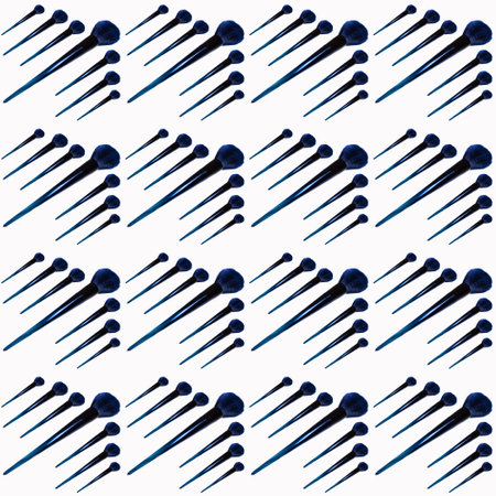 Cosmetic brushes in a seamless pattern on a white background, close-up, cosmetics advertising,...