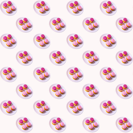 Cupcakes with white and pink cream on a white plate on a white background, flat layout, seamless pattern, wallpaper, banner, templateの写真素材