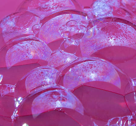 Soap bubbles on a red background, close-up, macro, pattern, texture