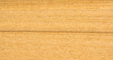 Chipboard stacked in a chappelle on the warehouse floor, copy space, background, texture, patternの写真素材