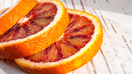 Red orange sliced, close-up, copy space, template, postcardの写真素材