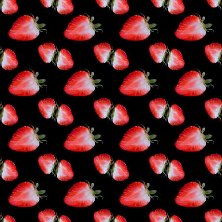 Strawberry halves laid out in a line on a black background close-up, copy space, pattern, templateの写真素材