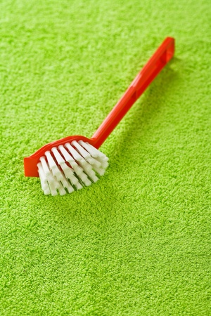 red brush on green towelの写真素材
