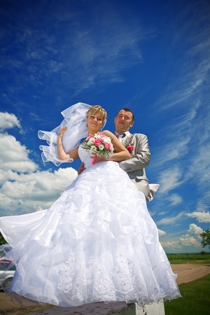 bride and groom on the skyの写真素材