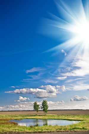 lake and sky with sunの写真素材