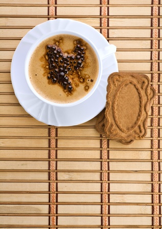 blue mug with espresso coffee with Cookies on a wum matの写真素材