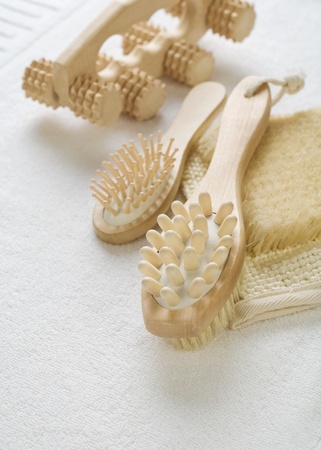 woden bathing objects on white cotton towelの写真素材