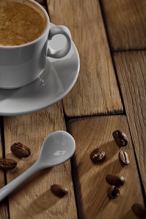 coffee cup and spoon on wooden tableの写真素材