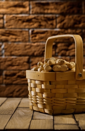 peanuts in wooden basketの写真素材