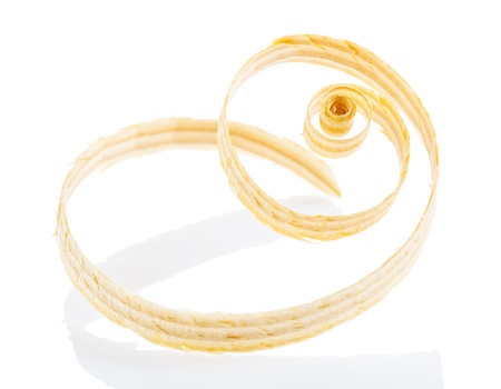 a single wooden shaving isolated on whiteの写真素材