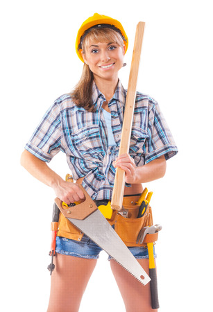 sexy female worker with carpenter tools isolated on white backgroundの写真素材