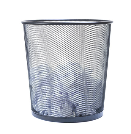 Trash can filled with crumbled paper isolated on white backgroundの写真素材