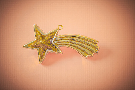 golden christmas star onlight brown backgroundの写真素材