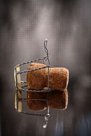 single corck of champagne on mirror surfaceの写真素材