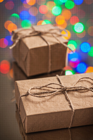 two vintage paper gift boxes on surface of mirrorの写真素材