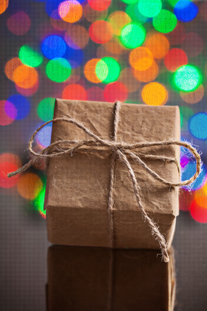 vintage paper gift box on table with mirror surfaceの写真素材