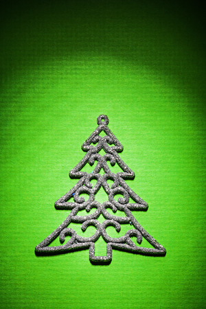 christmas toys simbol of fir tree on green backgroundの写真素材