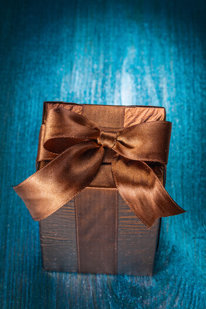 brown gift box on  blue boardの写真素材