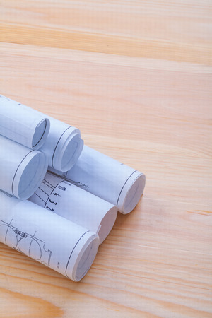 stack of white bluprints on wooden board with copyspaceの写真素材