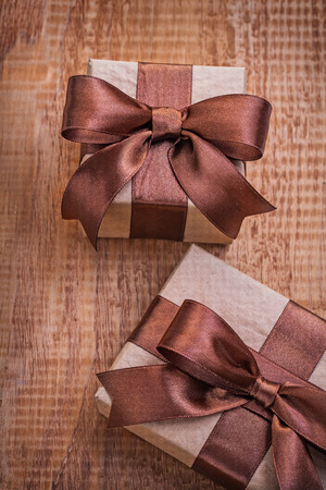 brown vintage gift boxes on old wooden boiardの写真素材
