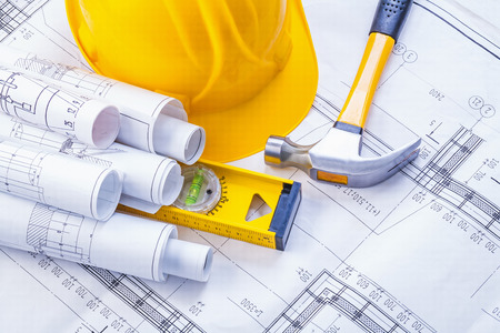 claw hammer construction level helmet rolled blueprints horizontの写真素材