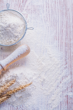 copyspace image sieve with white natural flour rolling pin ears of rie on vintage wooden desk food and  drink conceptの写真素材