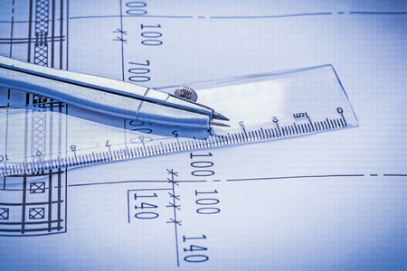 classical compass on transparent ruller close up viewの写真素材