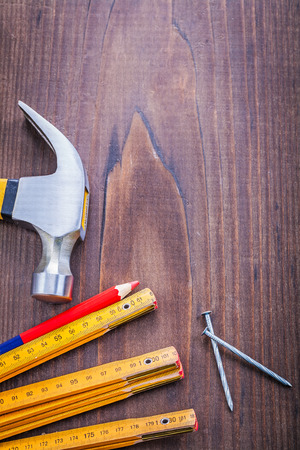 composition of construction tools claw hammer pencil wooden rullの写真素材