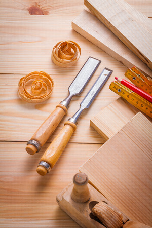 carpentry chisels and other tools on wooden boards constructionの写真素材