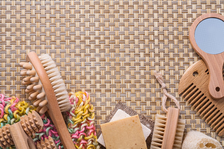 classical bathroom accessories on wicker background with copyspa
