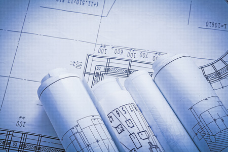 four rolled blueprints close up viewの写真素材