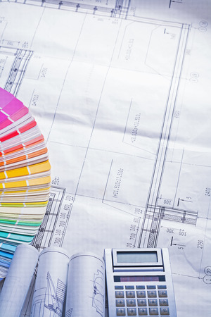 rolled up white blueprints color palette calculator compsotionの写真素材