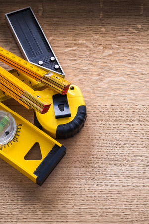 Wood oaken brown board with yellow units of measurement construction conceptの写真素材