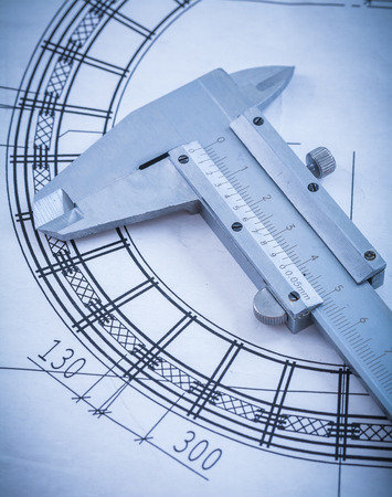 Close up of metal trammel caliper on blueprint construction concept.の写真素材