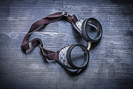 vintage goggles on wood board.の写真素材