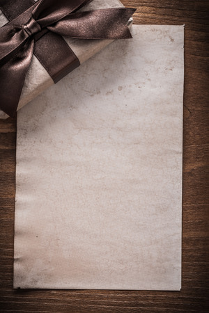 Packed present box paper on vintage wood board holiday concept.の写真素材