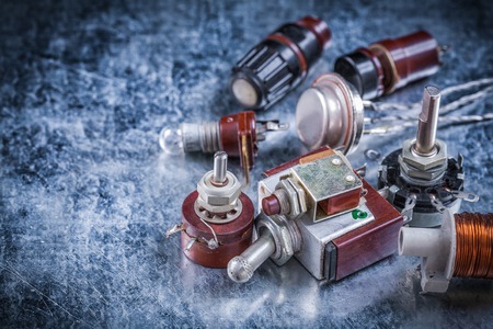 Composition of electric devices on metallic background vintage electricity concept.の写真素材