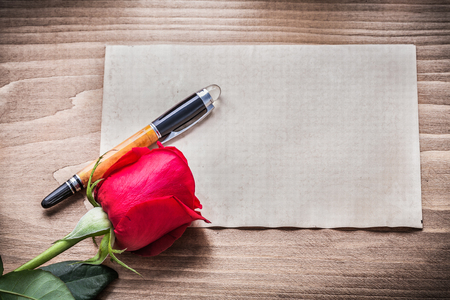 Blank sheet of paper red rose fountain pen holiday concept.の写真素材
