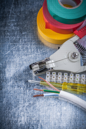 Set of electrical equipment on scratched metallic background electricity concept.の写真素材