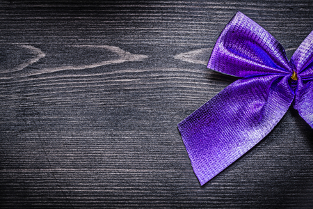 Christmas holiday bow on wooden board horizontal view.の写真素材